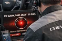 GM dealership technician using MDI2 and SPS2 programming tools showing factory programming limitations